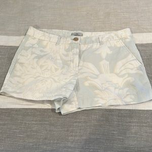 Pale blue/green with white and tan floral design